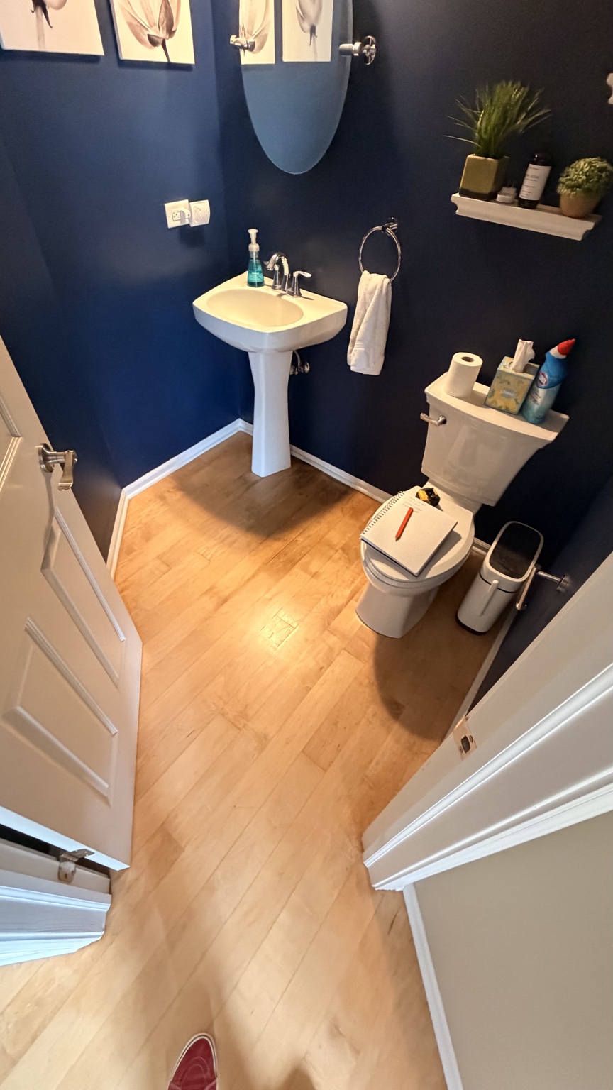 Powder room completed with a light tile floor and fixtures reinstalled